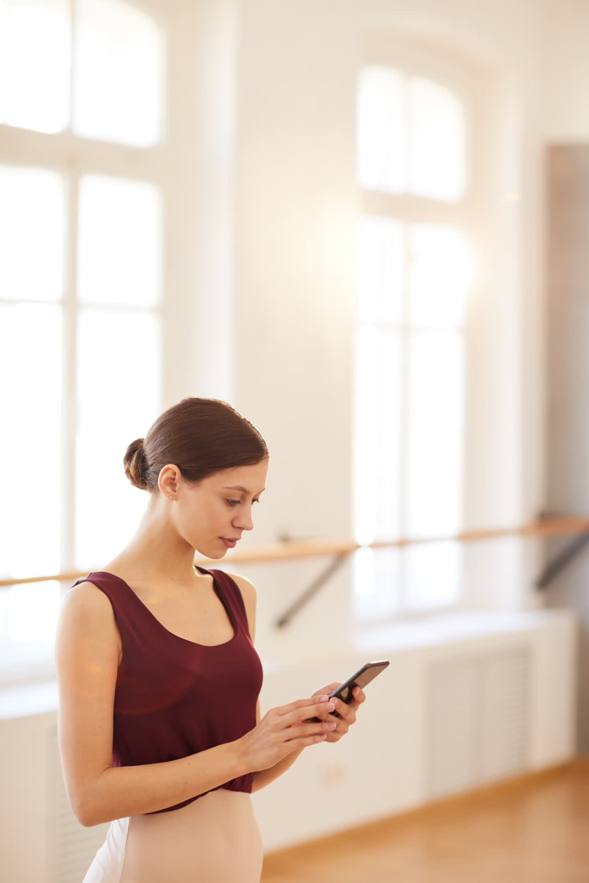Dancer using the Bloom app in a sunlit studio